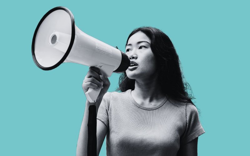 Woman holds a megaphone