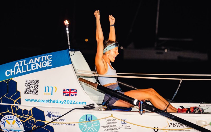 Miriam celebrating as she finishes the Talisker Whisky Atlantic Challenge