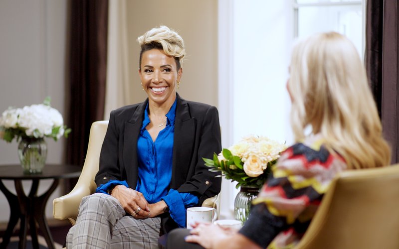 Dame Kelly Holmes smiles at the camera