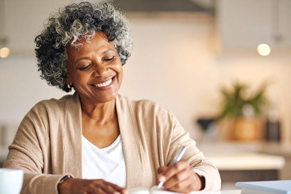 Woman tracking menopause symptoms at work